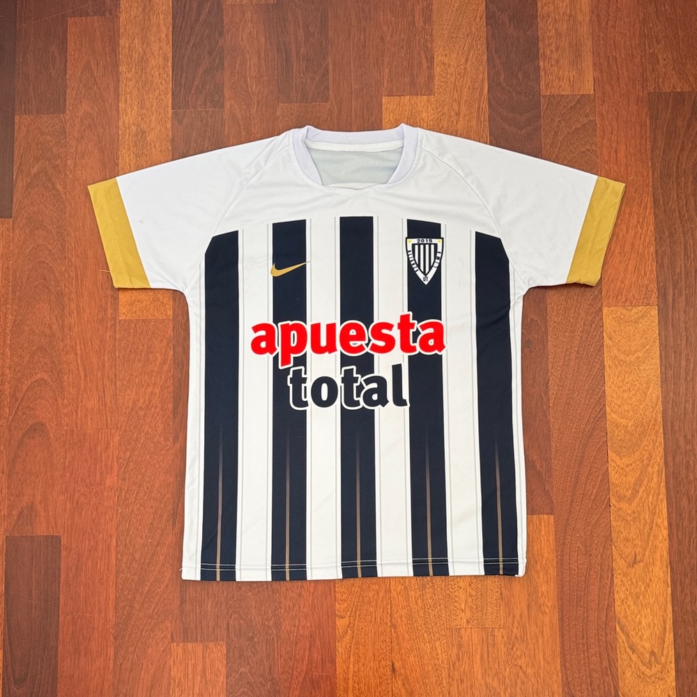 Nike Kids Black and White Striped Jersey with Gold Accents